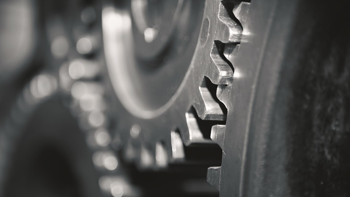 Close-up of gears in dark steel gray