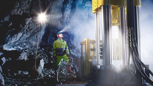 Person standing in a mining environment